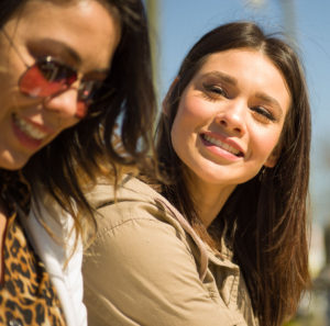 two sisters smiling